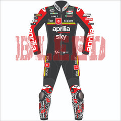 Front view of the 2024 Aleix Espargaro Aprilia Racing suit for the British GP, featuring a sleek black and red design with detailed sponsor logos, including Aprilia, Sky, Michelin, and Ruby. The suit is customized for Aleix Espargaro, with graphic elements on the legs and arms reflecting his racing identity.