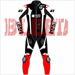 Front view of Jack Miller Yamaha MotoGP 2025 test race suit in black, red, and white with number 43, sponsor logos including Quad Lock and CAT, and protective red knee armor – custom leather racing suit by BLEED.