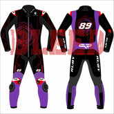 A front and back view of Jorge Martin's 2025 MotoGP racing suit, showcased during the Barcelona winter test. The suit boasts a bold design combining blue, white, and red, complemented by black accents. The number 89 is prominently positioned on both the chest and back. Various sponsor logos are featured, including Pramac Racing and Ducati. The suit is equipped with protective padding on the knees and elbows, along with additional branding on the arms and legs.