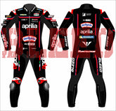Front and back display of Jorge Martin's 2025 Aprilia MotoGP race suit by BLEED, highlighting red-and-black leather panels, full sponsor branding including Sterilgarda, Aprilia, Piaggio Group, and Michelin. Features bold BLEED logos and MARTINATOR name on the lower back.
