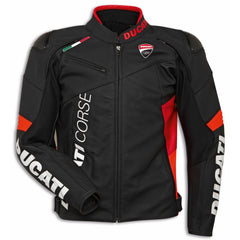 Top-down view of a Ducati Corse C6 motorcycle jacket in black and orange leather, featuring official Ducati branding on the chest and sleeves, with high-quality stitching and a durable design. The jacket includes a red inner collar lining, Italian flag detailing, and the Ducati logo prominently displayed on the chest. The jacket is laid flat on a beige carpet, showcasing its sleek, race-inspired design.