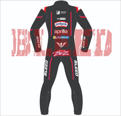 Rear view of the Marco Bezzecchi 2025 Aprilia Racing MotoGP leather suit, showcasing sponsor logos from Piaggio Group, Sterilgarda, Michelin, and Aprilia. BLEED branding appears on the arms and legs, with a stylized BEZZ logo on the lower back.