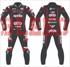 front and back image of Marco Bezzecchi's 2025 Aprilia MotoGP race suit, designed by BLEED. Features sponsor placements from Sterilgarda, Aprilia Racing, and Michelin, with reinforced padding on knees and the colorful 'BEZZ' graphic on the lower back.