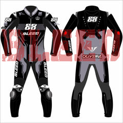 Front and back view of Miguel Oliveira’s 2025 MotoGP test race suit by Bleed, designed in a black, grey, and red theme with “88” branding, RUBY logos on arms and legs, and “Oliveira” on the lower back—featuring aerodynamic paneling and race sponsor logos.