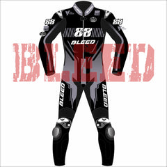 Front view of Miguel Oliveira’s custom MotoGP 2025 test race suit in black and grey, with bold “88” number on the chest, Bleed branding on chest, arms, and thighs, and detailed graphics along the knees and legs for aggressive styling.