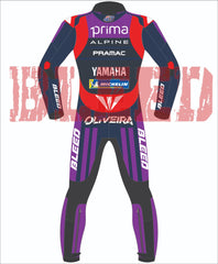 Rear view of Miguel Oliveira’s custom 2025 MotoGP race suit in Yamaha Prima Alpine Pramac colors, featuring vibrant red, navy blue, and purple panels with ‘BLEED’ branding on the arms and legs.
