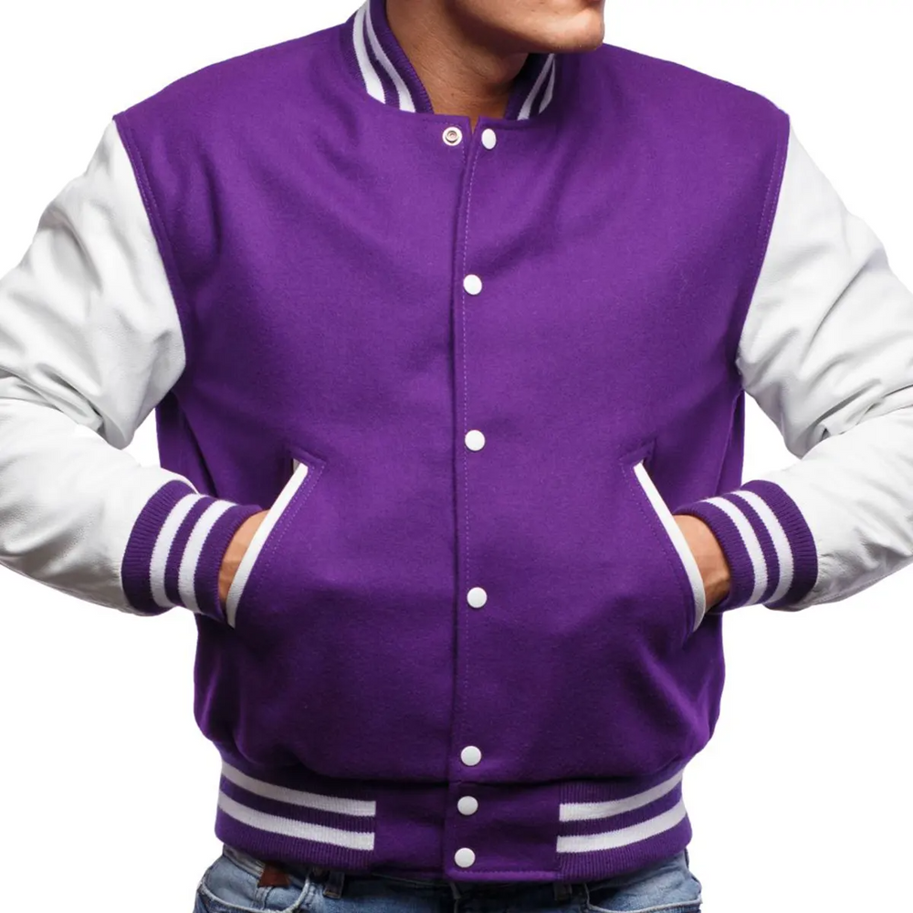 A person wearing a purple and white varsity jacket with leather sleeves and metal buttons.