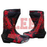 Front view of Marc Márquez 93 Ducati red black motorbike racing boots showing aerodynamic shin guards and toe sliders.