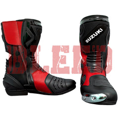 Display of Suzuki red black motorbike boots showing detailed stitching, aerodynamic panels, and ventilation zones for comfort on long rides.
