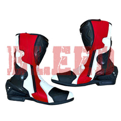 Close-up view of Yamaha racing motorbike boots with dual-tone red and white panels and ankle protection.
