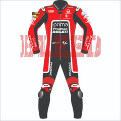 Front view of Franco Morbidelli's 2024 Pramac Race Suit for the British GP. The suit is predominantly red with black and white accents, featuring prominent 'PRIMA PRAMAC DUCATI' branding on the chest. Sponsor logos such as Michelin, FIAMM, and Akrapovic are visible on the shoulders and arms, with the number 89 on the left shoulder. The suit has black leg panels with 'PRAMAC' branding in white and protective knee pads integrated for added safety