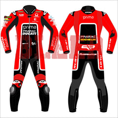 Jorge Martin's 2024 Pramac Race Suit for the British GP, shown in front and back views. The suit is predominantly red with 'PRIMA PRAMAC DUCATI' branding on the chest, complemented by sponsor logos including Michelin, FIAMM, and the number 89. The back features a black panel with additional logos, including 'PRIMA PRAMAC' and 'MICHELIN.' The suit includes protective padding at the knees and elbows, designed for optimal safety during high-speed racing events.