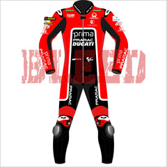 Front view of Jorge Martin's 2024 Pramac Race Suit for the British GP. The suit is predominantly red with black and white accents, featuring prominent 'PRIMA PRAMAC DUCATI' branding on the chest. Sponsor logos such as Michelin, FIAMM, and Akrapovic are visible on the shoulders and arms, with the number 89 on the left shoulder. The suit has black leg panels with 'PRAMAC' branding in white and protective knee pads integrated for added safety