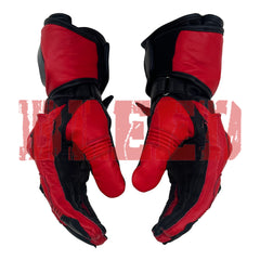 Side view of the Jorge Martin MotoGP 2024 Race Gloves in red and black. The gloves highlight the ergonomic design and reinforced finger sections, providing maximum comfort and protection. The durable leather construction and secure wrist straps make these gloves ideal for professional racing, ensuring a snug fit and enhanced grip during high-speed maneuvers