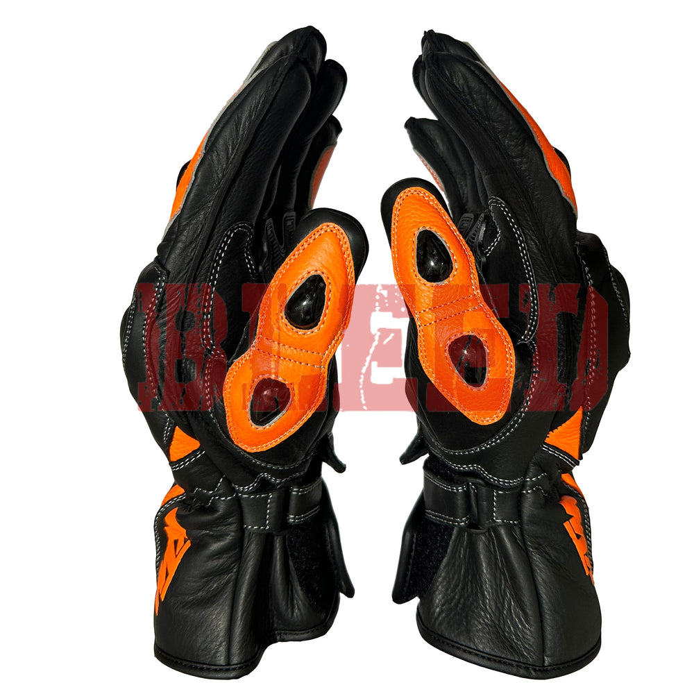 KTM Red Bull racing gloves in black and orange with reinforced knuckles, durable leather construction, and bold KTM branding. Designed for superior grip and protection, perfect for motorcycle enthusiasts.