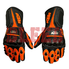 KTM Red Bull racing gloves in black and orange with reinforced knuckles, durable leather construction, and bold KTM branding. Designed for superior grip and protection, perfect for motorcycle enthusiasts.