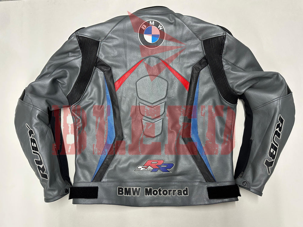 Back view of the BMW Motorrad Racing Motorcycle Jacket. The gray leather jacket features a large BMW logo centered at the upper back, with red and blue accents, along with the 'BMW Motorrad' branding and SBK logo near the waist. Designed for motorcycle riders, offering a stylish and protective fit.