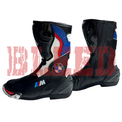 Front angled view of BMW Motorrad black blue motorcycle boots highlighting shin armor, steel toe sliders, and full-grain leather finish for professional bikers.