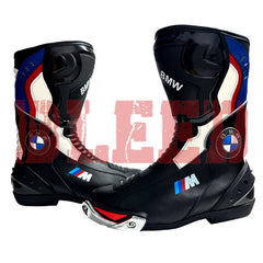 Pair of BMW Motorrad black and blue motorbike leather boots designed for track and street use with CE-certified armor and anti-slip rubber sole.