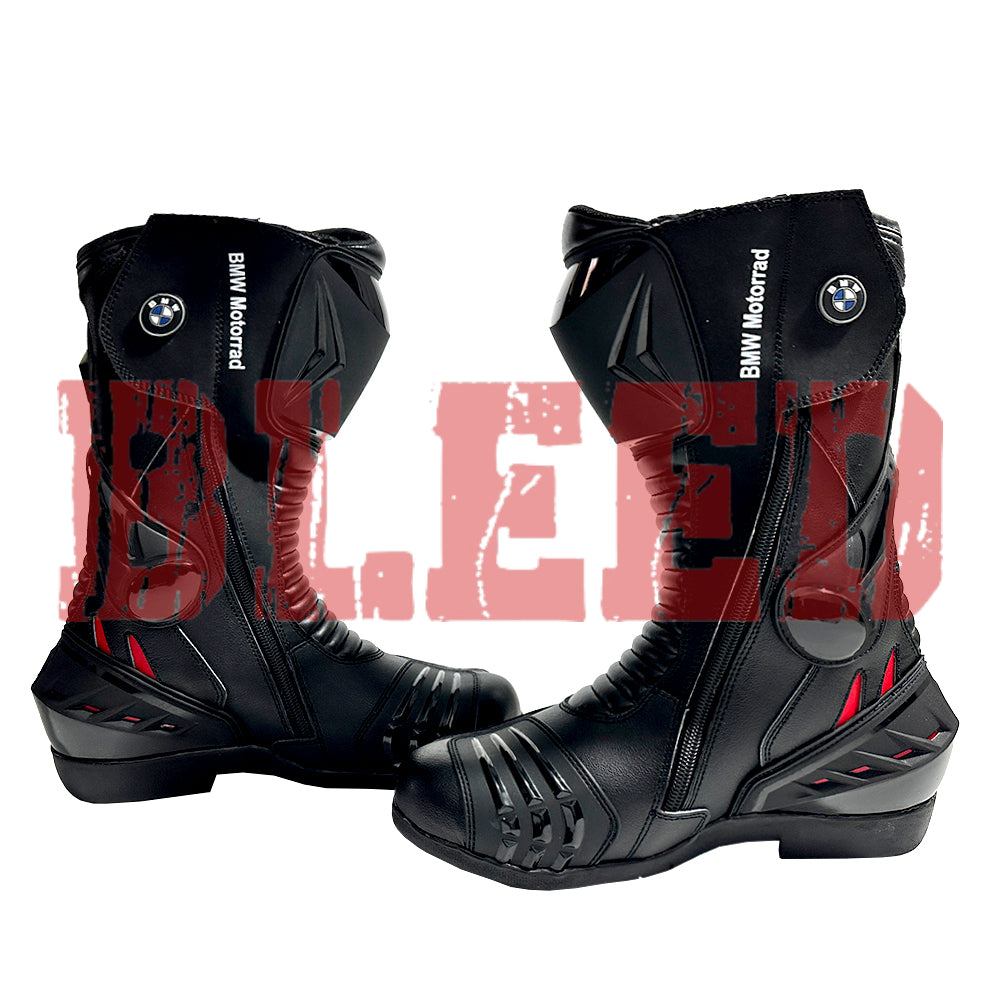 Front view of BMW Motorrad red black motorcycle boots showing full-grain leather finish, shin protection, and flexible accordion stretch panels.