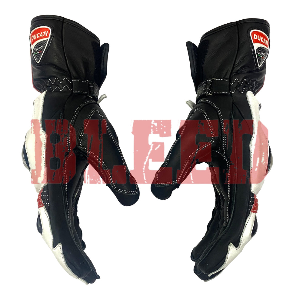 Side view of Ducati Corse motorbike gloves in black with white and red accents, featuring reinforced stitching, pre-curved fingers, and Ducati logos
