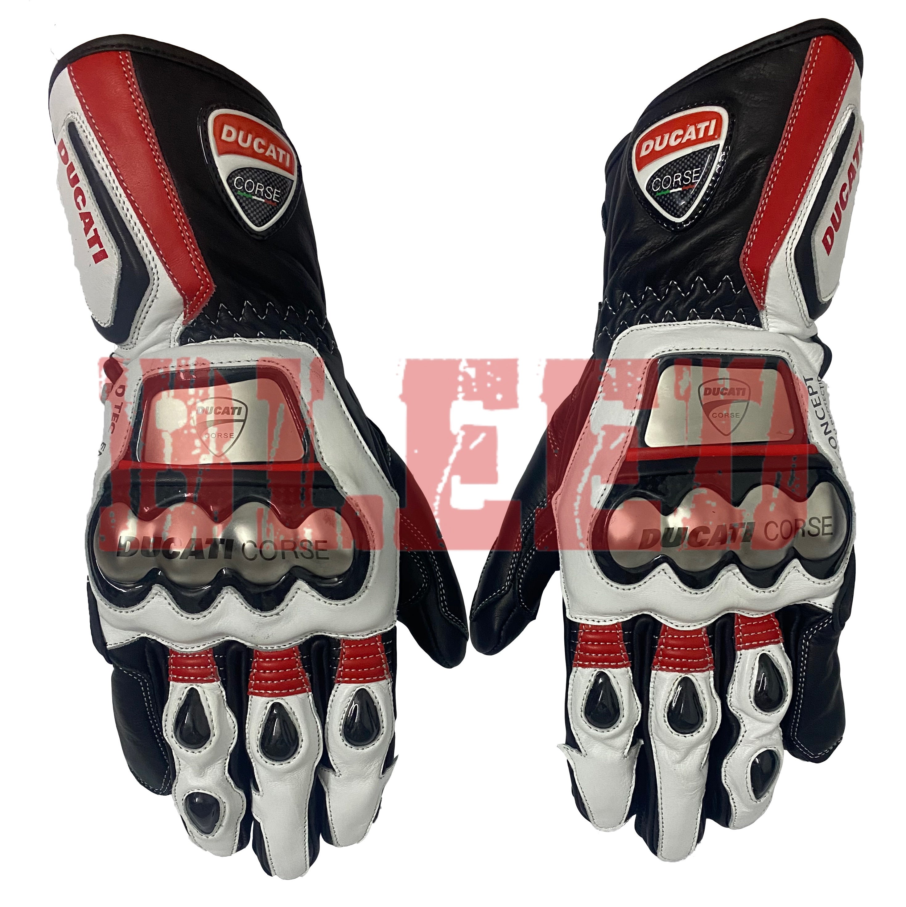 A pair of Ducati Corse racing motorbike gloves with a black, white, and red color scheme. The gloves feature protective metallic knuckle armor and padded fingers. The Ducati logo is prominently displayed on the top of each glove.