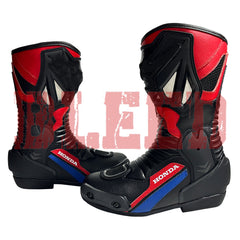 Side view of Honda Repsol black red motorbike leather boots showing aerodynamic panels, reinforced shin guards, and steel toe sliders for race riders.