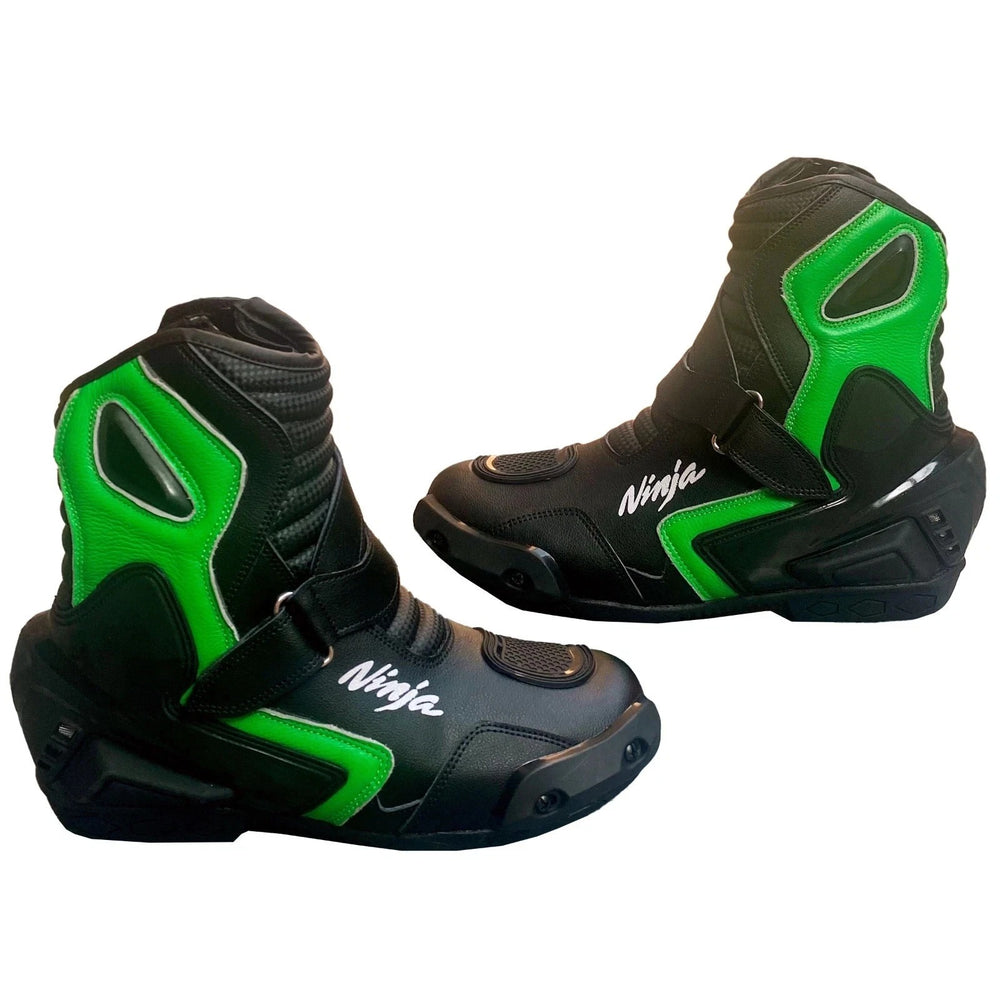 Pair of black and lime green Kawasaki Ninja professional leather motorcycle racing boots featuring toe sliders, ankle protection, and reinforced gear shift pads
