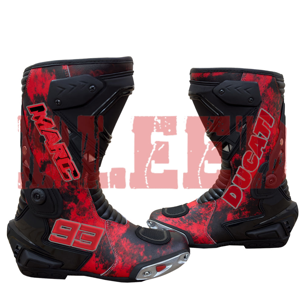 Front view of Marc Márquez 93 Ducati red black motorbike racing boots showing aerodynamic shin guards and toe sliders.