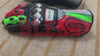 Front view of Aprilia racing motorbike gloves featuring reinforced knuckle protection and vibrant red and green accents by BLEED