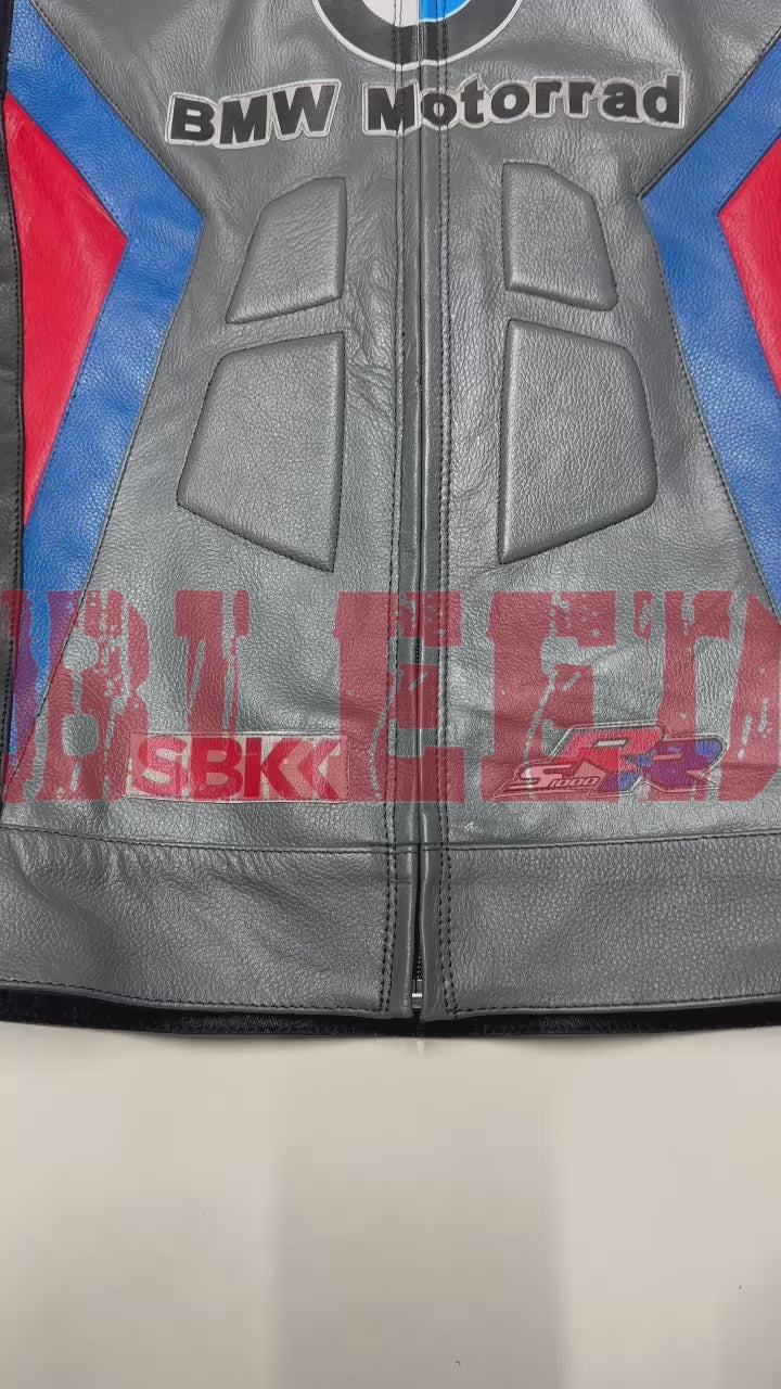 Front view of the BMW Motorrad Racing Motorcycle Jacket in gray with black, blue, and red detailing. The jacket displays prominent sponsor logos and is crafted from premium leather, ideal for motorbike riders seeking style and protection