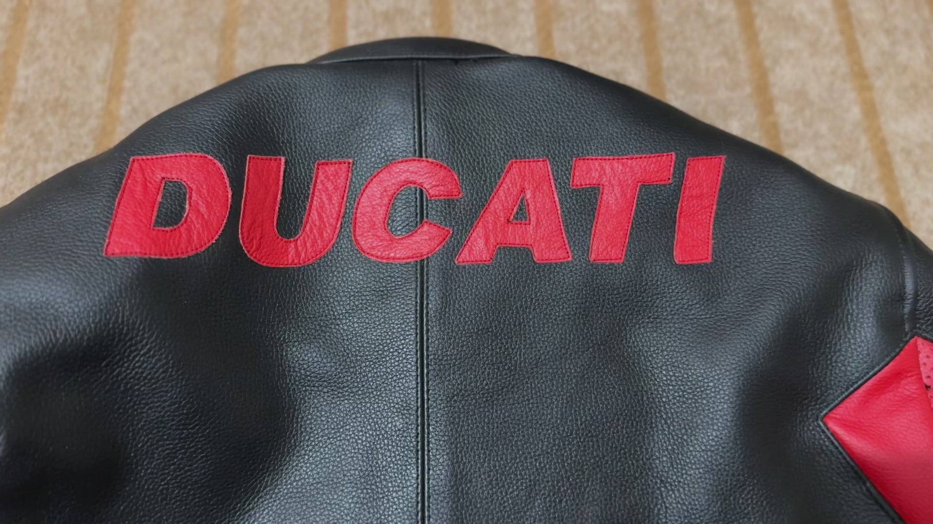 Ducati C4 Leather Motorcycle Jacket – Black and Red Style with Iconic Ducati Logo, High-Quality Perforated Leather, and Sleek Fit for Riders