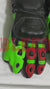 Monster Energy Racing Gloves with a sleek black design, highlighted by vibrant green and red accents. Featuring the iconic Monster Energy logo on the wrist and protective padding on the knuckles and fingers, these gloves are crafted from durable materials to provide superior grip and control, making them perfect for professional racers and motorsport enthusiasts.