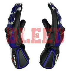 Suzuki GSX-R motorbike racing gloves in black and blue with white accents. Features include reinforced knuckle armor, carbon fiber details, and Suzuki branding on the wrist guards. The gloves are ergonomically designed with pre-curved fingers for enhanced grip and control.