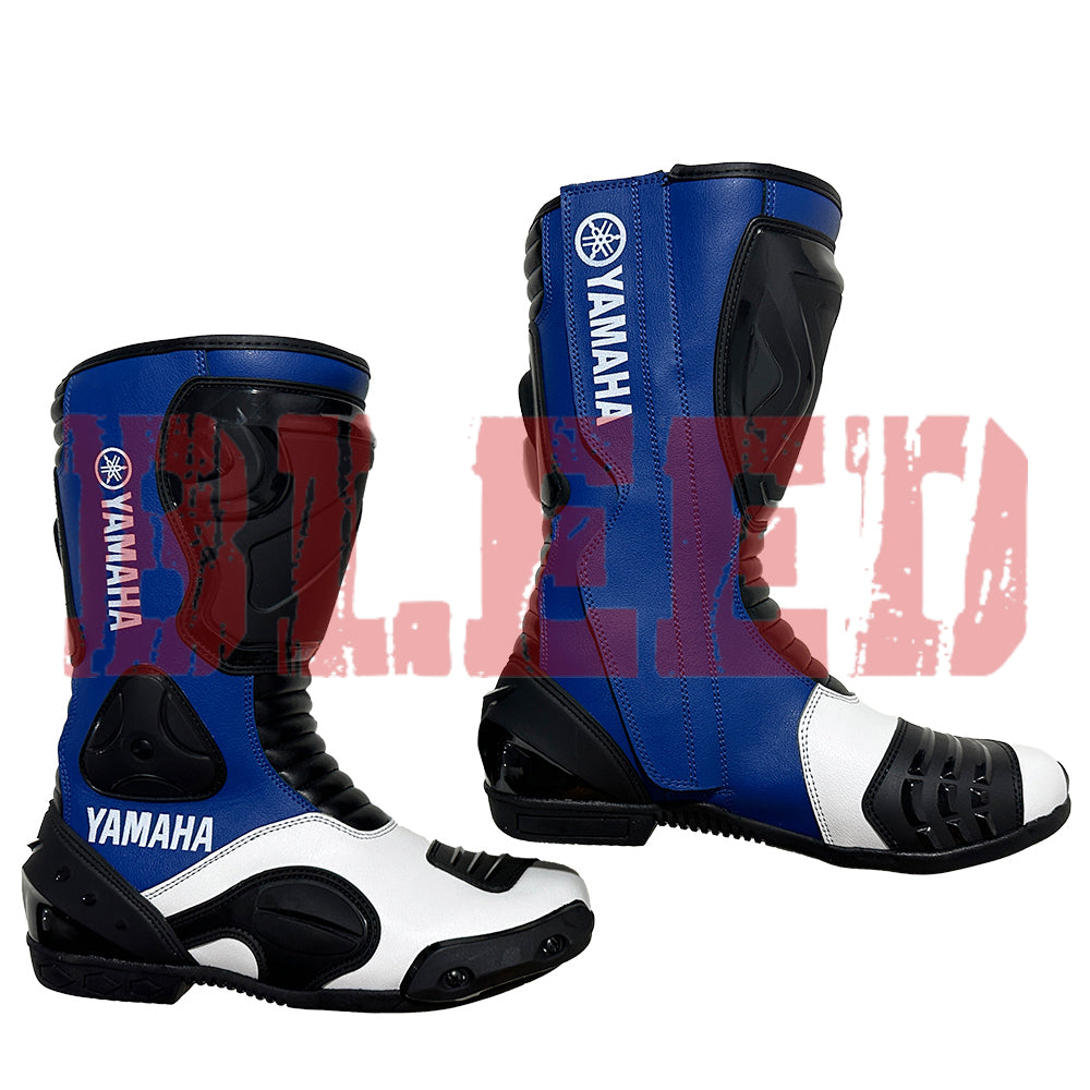 Yamaha blue racing boots with white highlights, reinforced toe sliders, and ergonomic padding for professional-level comfort.