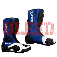 Yamaha blue racing boots with white highlights, reinforced toe sliders, and ergonomic padding for professional-level comfort.