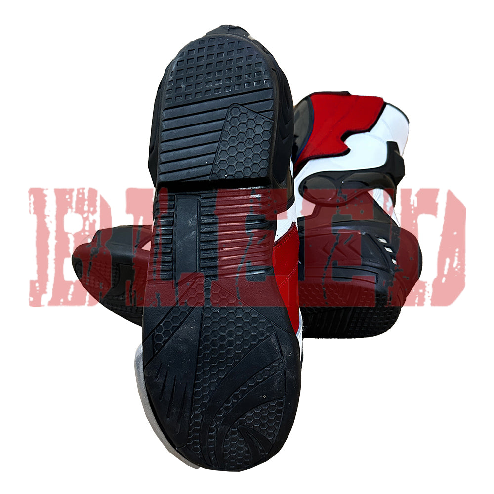 Bottom sole view of Yamaha racing boots displaying anti-slip tread and reinforced sole construction for riders.